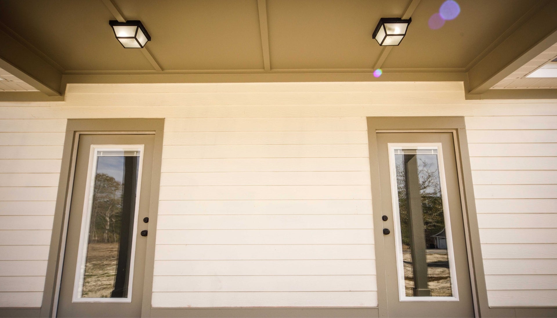 We offer siding services in Virginia Beach, Virginia. Hardie plank siding installation in a front entry way.